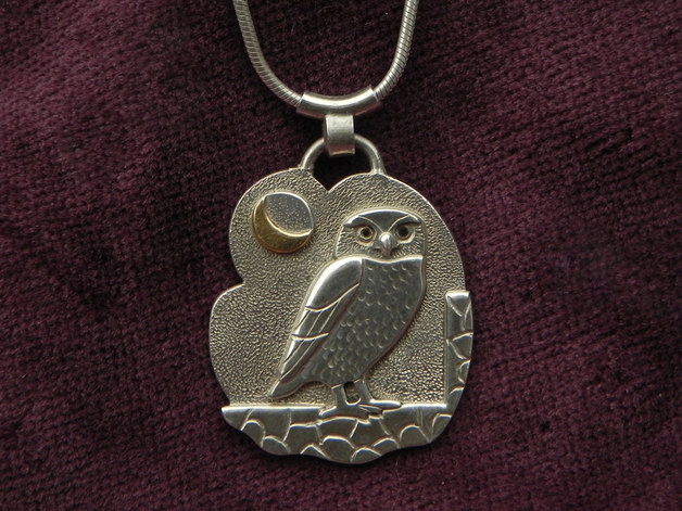 owl on silver pendant