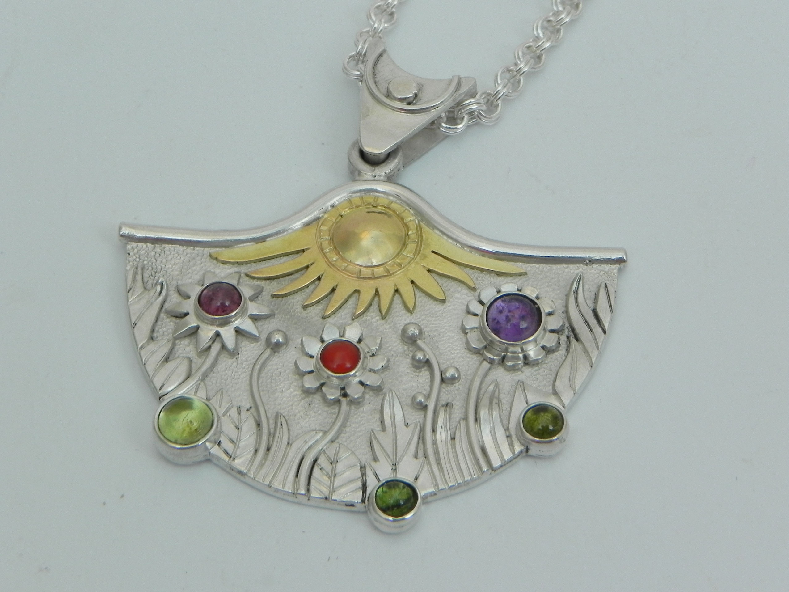 Silverpendant with stylistic flower meadow 2