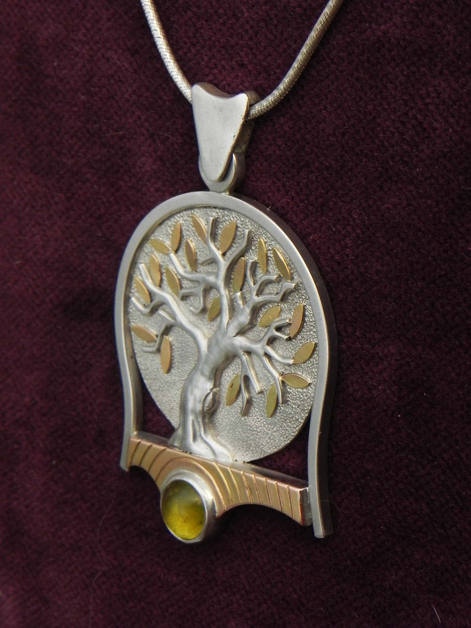 Olive trees on silver pendant