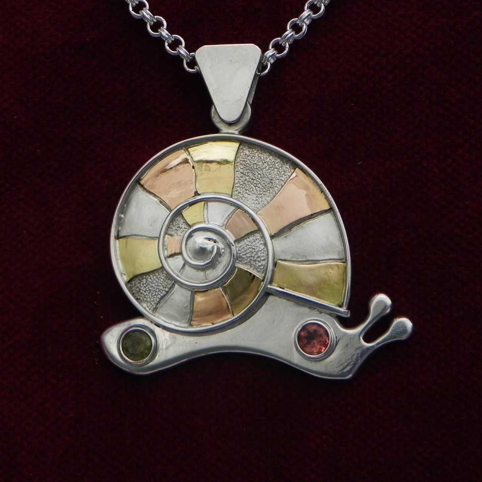 Snail with spiral on silverpendant Snail with spiral on silverpendant