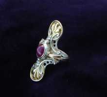 One-of-a-Kind silverring with a blossom of ruby and gold